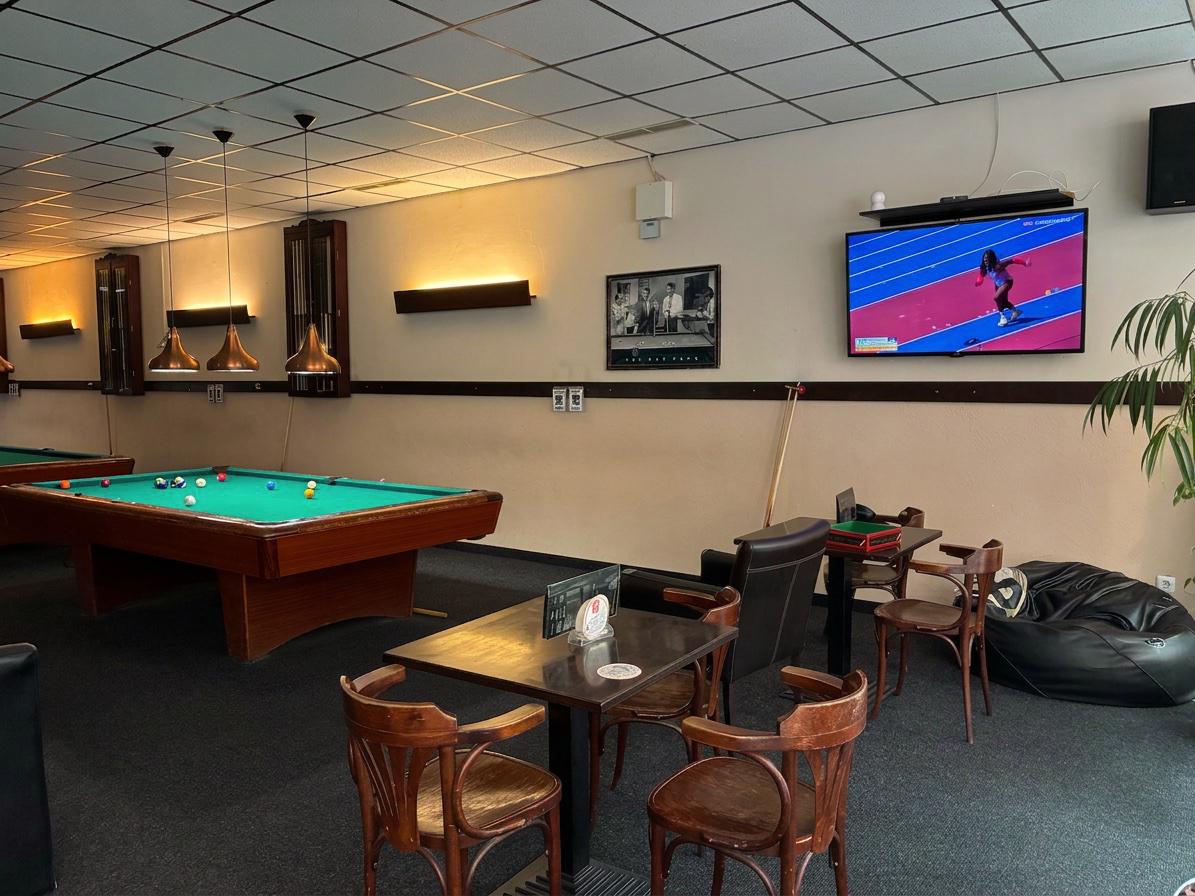 Seating area with TV and a pool table